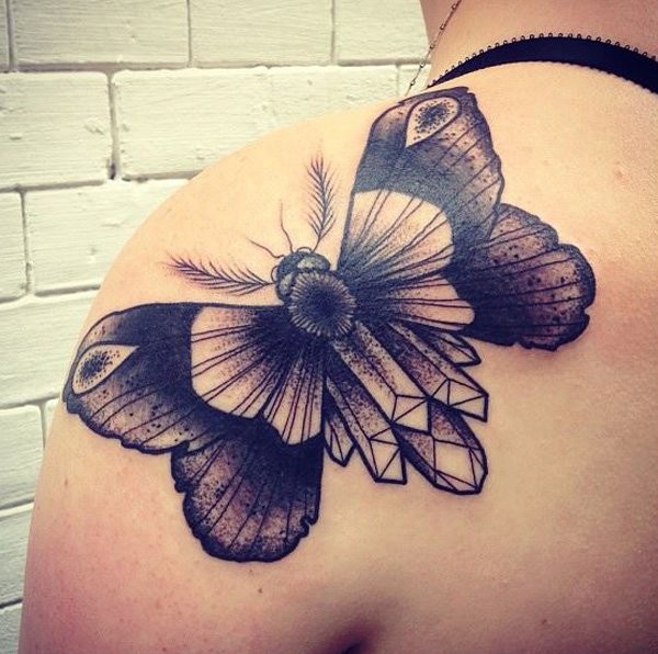 Stippling style black ink butterfly tattoo on shoulder