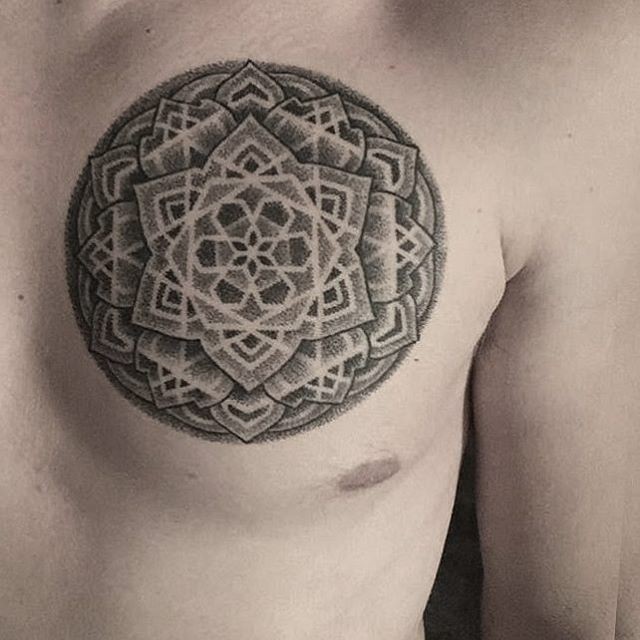 Stippling style black ink chest tattoo of big flowers