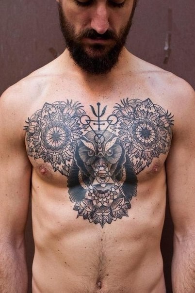 Stippling style black ink chest tattoo of various flowers and bear