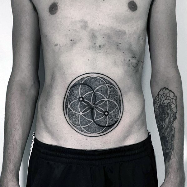 Stippling style black ink circles tattoo on belly