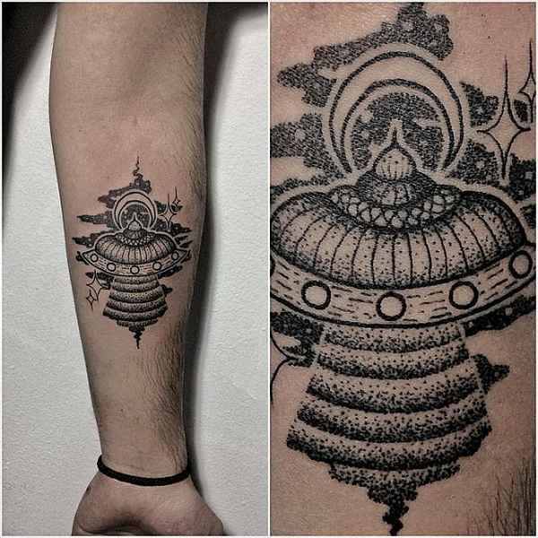 Stippling style black ink forearm tattoo of alien ship with stars