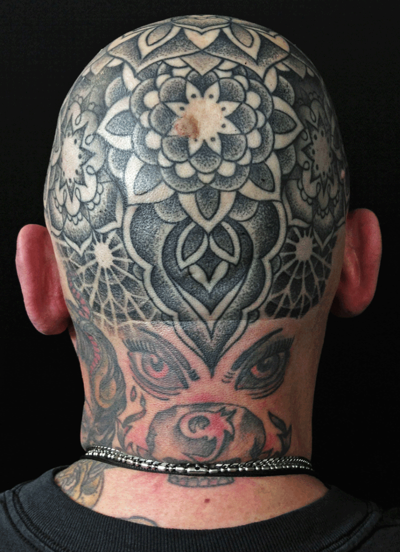 Stippling style black ink head tattoo of incredible flowers