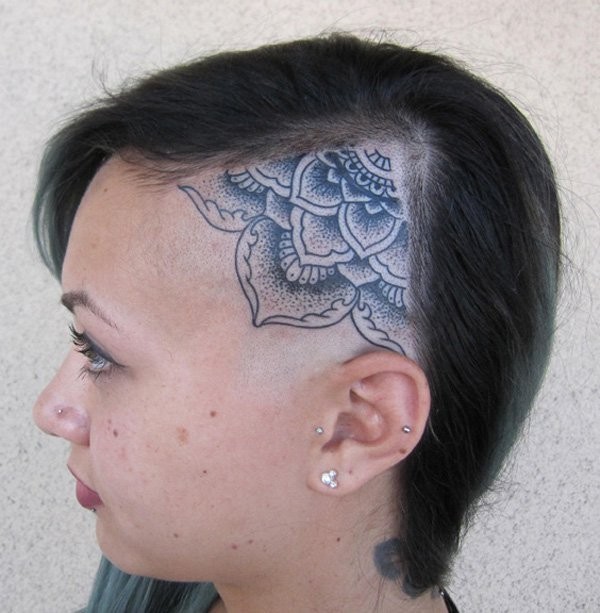 Stippling style black ink head tattoo of typical Hinduism flower