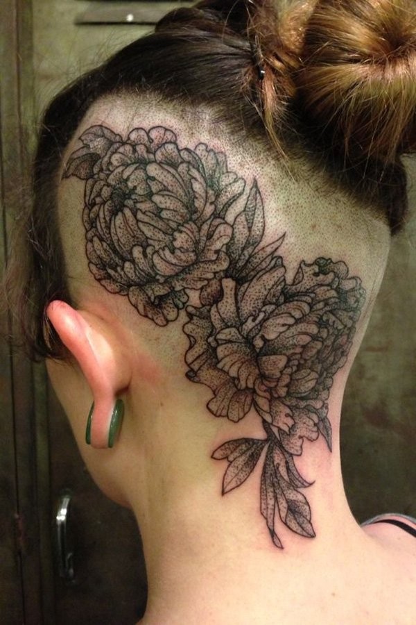 Stippling style black ink head tattoo of large flowers