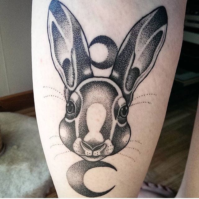 Stippling style black ink leg tattoo of rabbit with moons