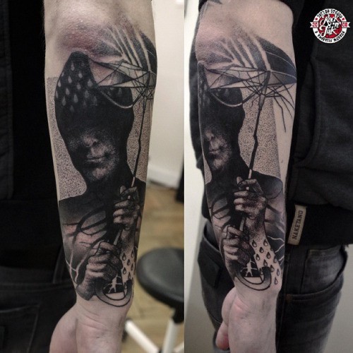 Stippling style black ink mystic man with umbrella tattoo on forearm