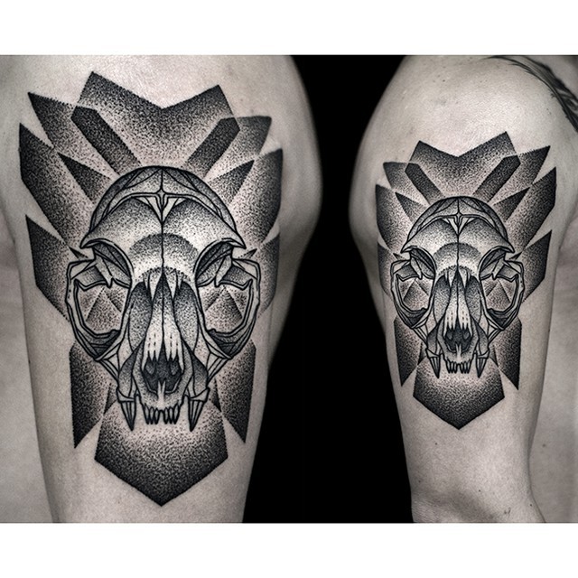Stippling style black ink shoulder tattoo of cat skull with ornaments