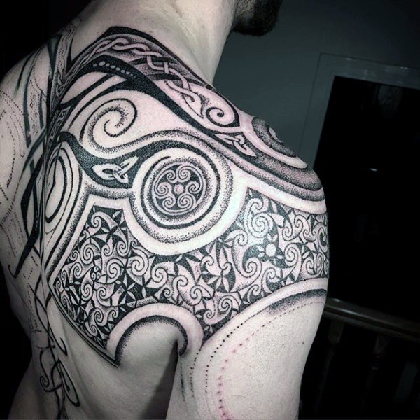 Stippling style black ink shoulder tattoo