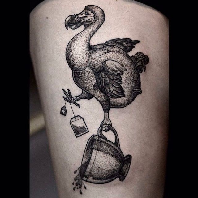 Stippling style black ink thigh tattoo of funny bird with tea bag and cup
