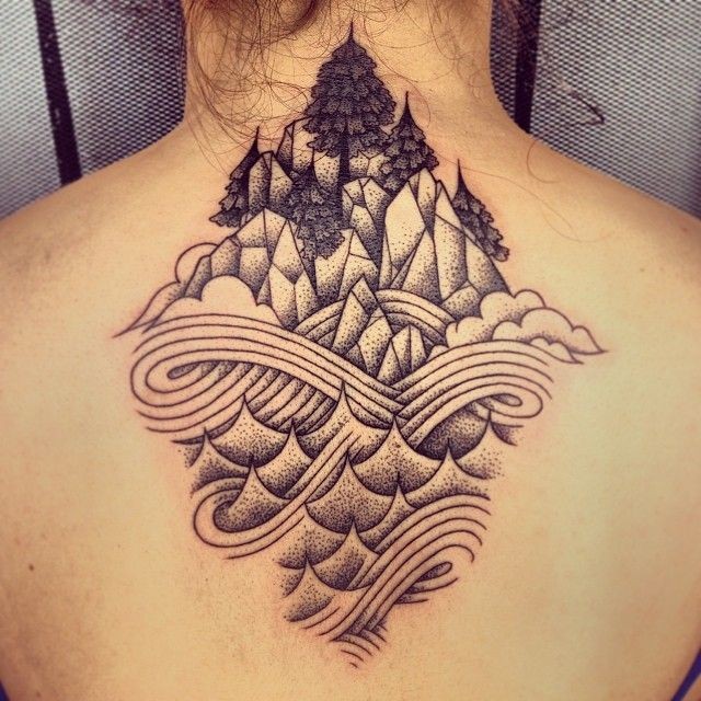 Stippling style black ink upper back tattoo of rock mountains with waves