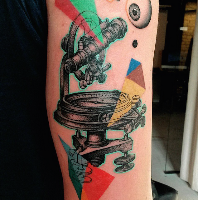 Stippling style colored arm tattoo of vintage telescope
