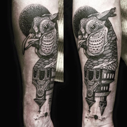 Stippling style colored arm tattoo of big birds head with old house