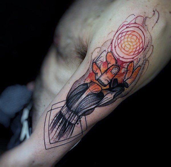 Stippling style colored human hand tattoo with glowing orb tattoo on shoulder