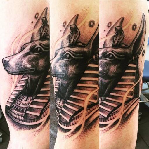 Stippling style detailed arm tattoo of ancient Egypt God Anubis