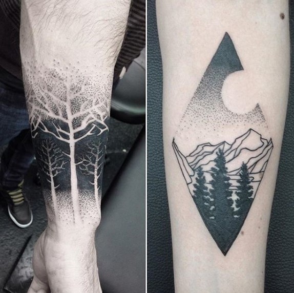 Stippling style forearm tattoo of forest with mountains