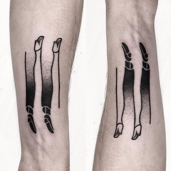 Stippling style interesting looking arm tattoo of human legs