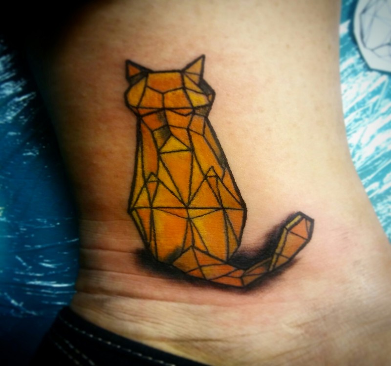 Stone like colored small cat tattoo on ankle