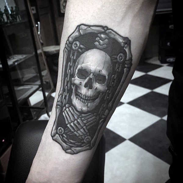 Stonework style amazing looking forearm tattoo of little portrait with skeleton and chains