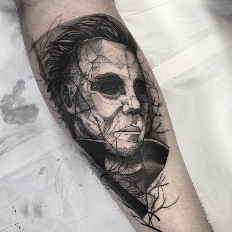 Stonework style black ink leg tattoo of creepy man face