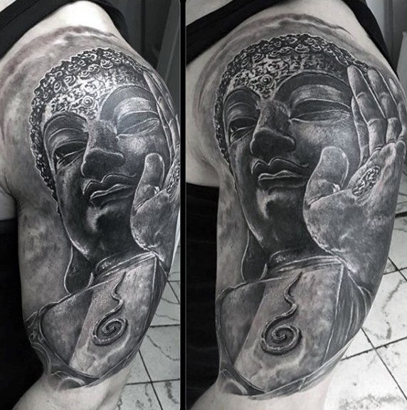 Stonework style black ink shoulder tattoo of large Buddha statue