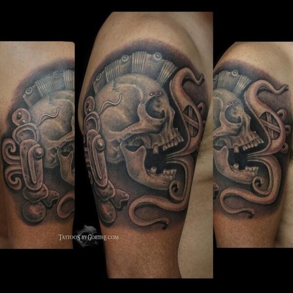 Stonework style colored shoulder tattoo of ancient statue