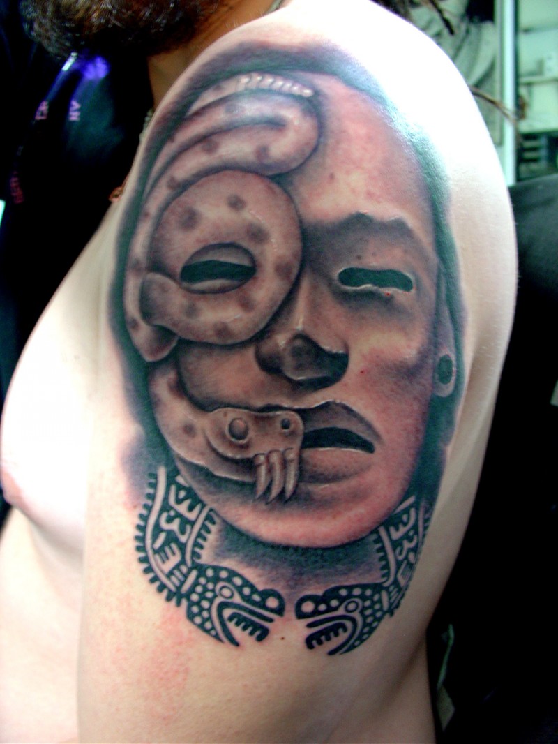 Stonework style colored shoulder tattoo of antic statue