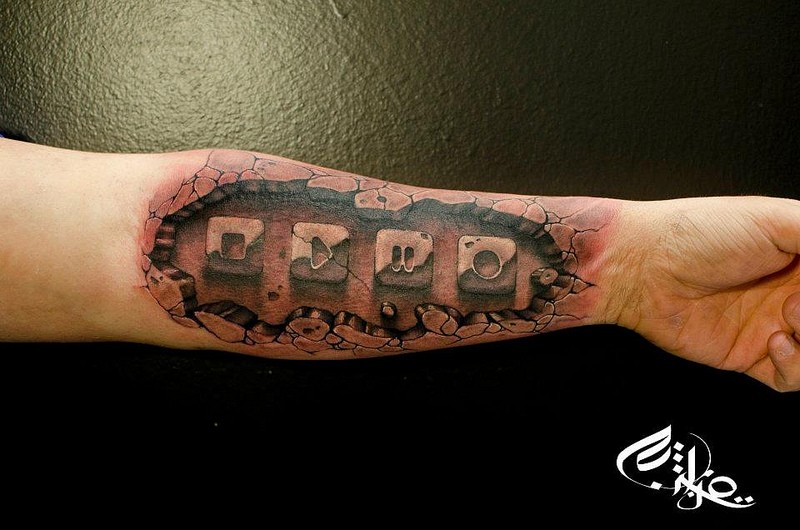 Stonework style detailed forearm tattoo of media player buttons