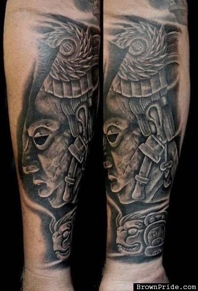 Stonework style forearm tattoo of ancient stone statue
