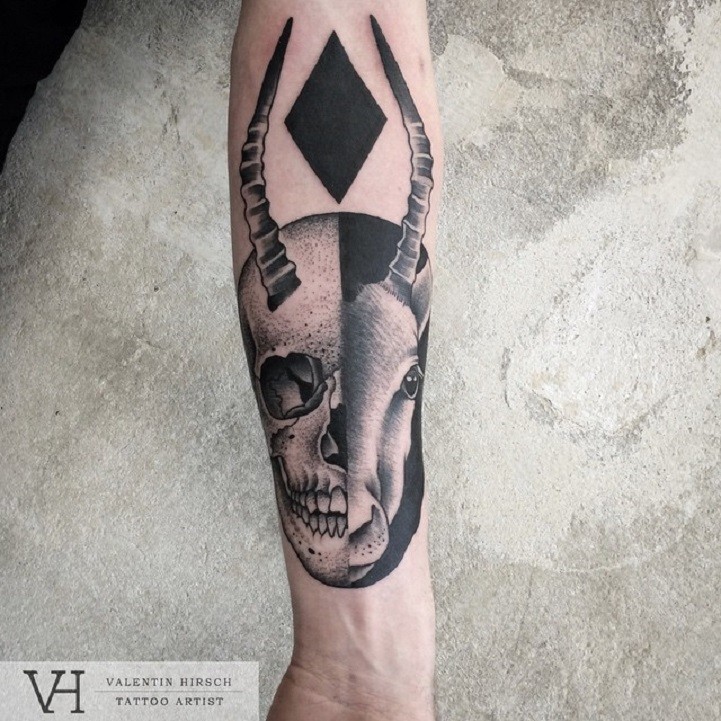 Strange and mystical designed by Valentin Hirsch forearm tattoo