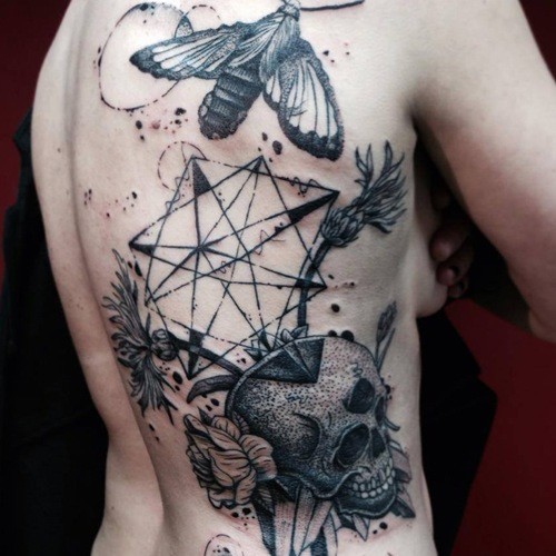 Strange combined black ink side tattoo of human skull with flowers and big butterfly