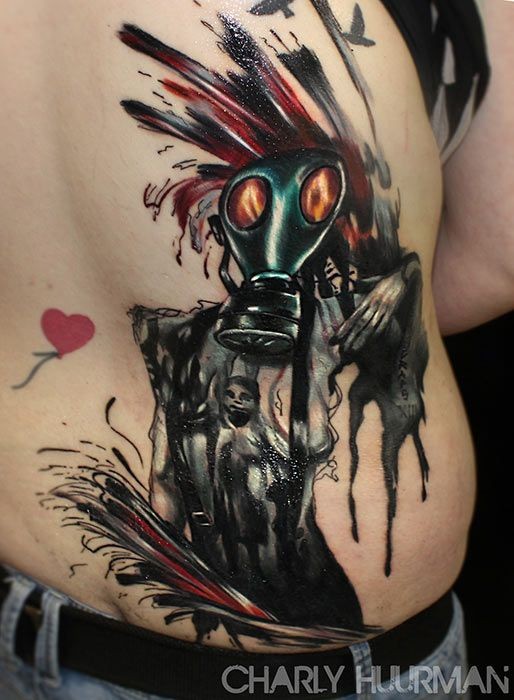 Strange looking abstract style colored side tattoo of gas mask with girl silhouette