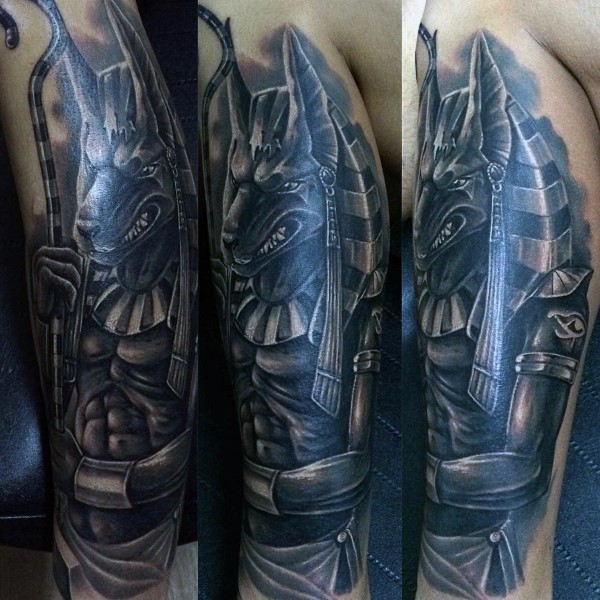 Strange looking black and white arm tattoo of ancient Egypt God Anubis