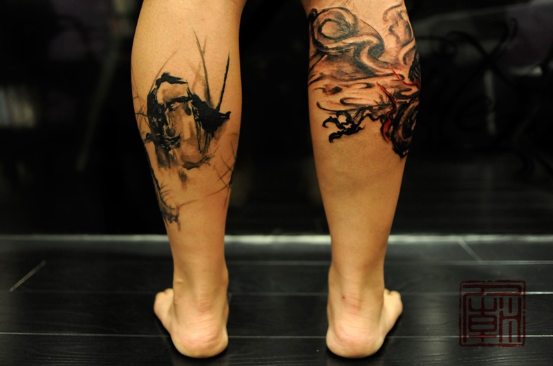 Strange looking black ink leg tattoo