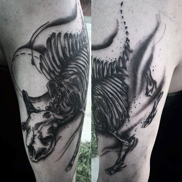 Strange looking black ink shoulder tattoo of goat skeleton