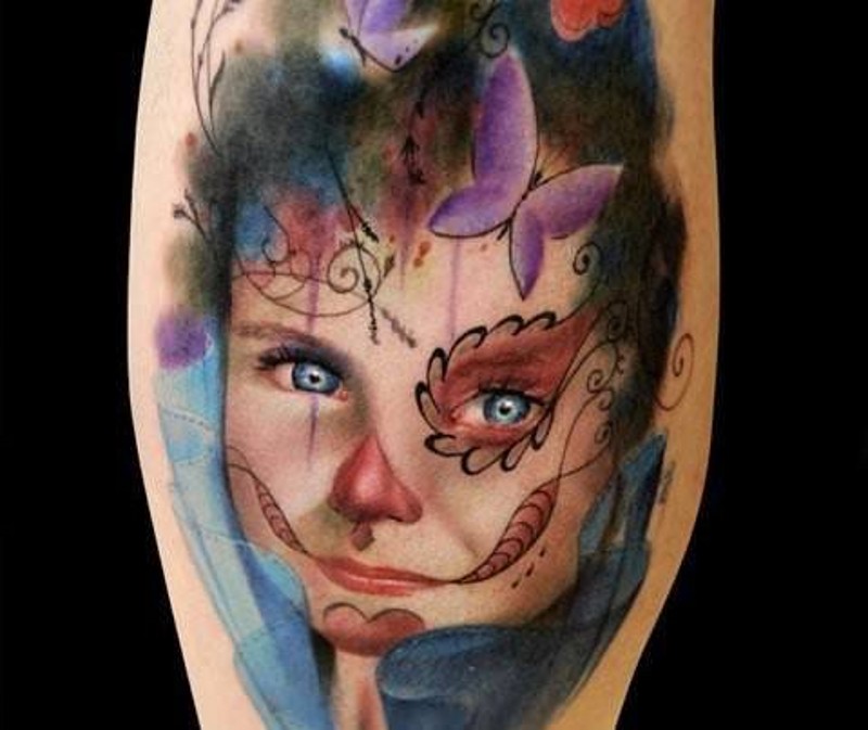 Strange looking colored girl portrait tattoo on with ornaments and butterflies