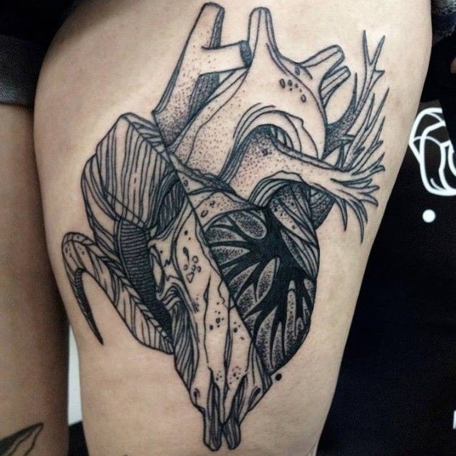 Strange looking dotwork style painted by Michele Zingales thigh tattoo of human heart with skull
