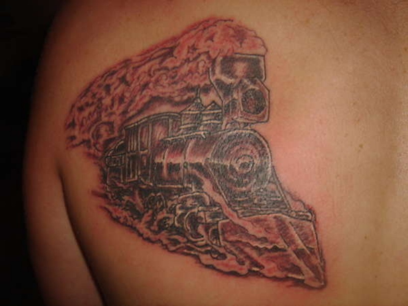 Strange looking large train tattoo on scapular