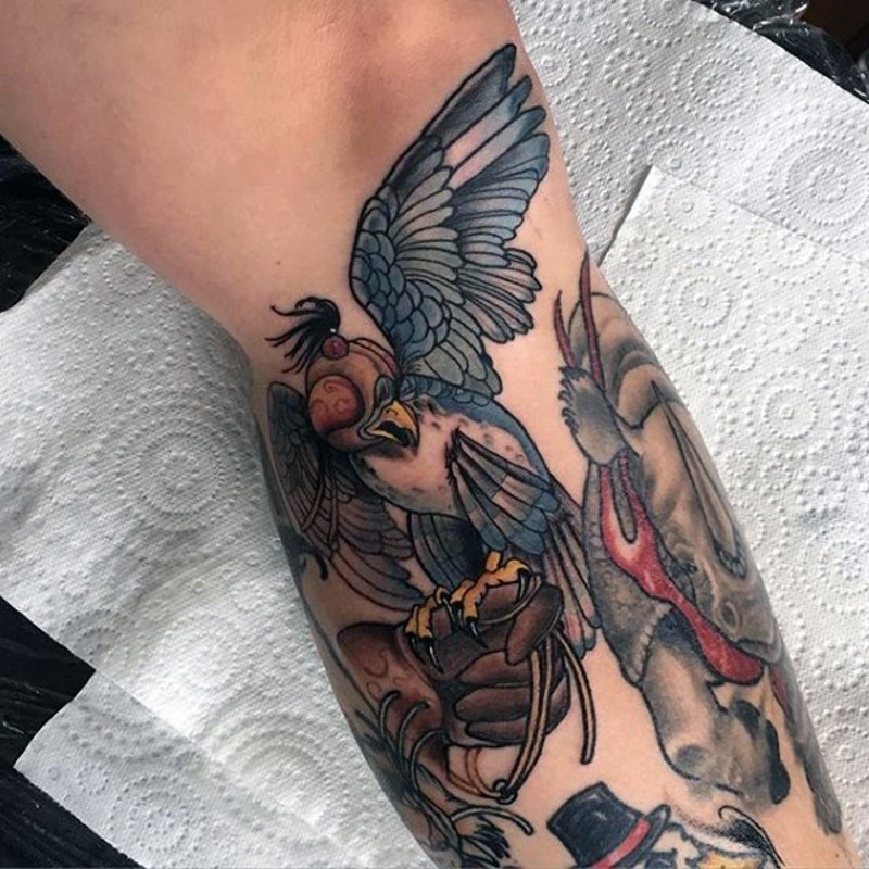 Strange looking painted colored leg tattoo of birds