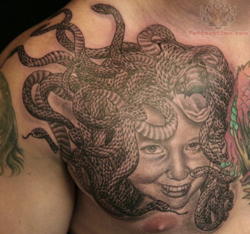 Strange Medusa like chest tattoo of girl portrait with snakes