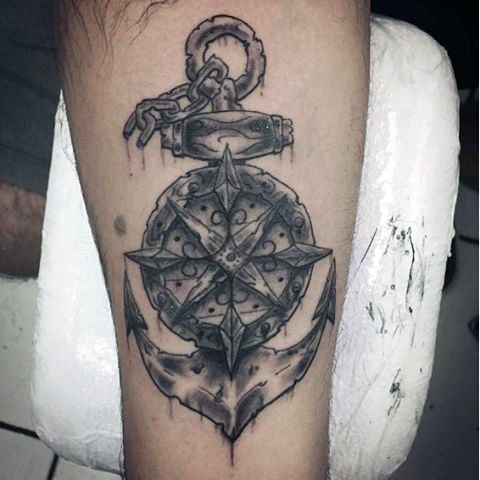 Stunning ancient black ink chained anchor tattoo on arm