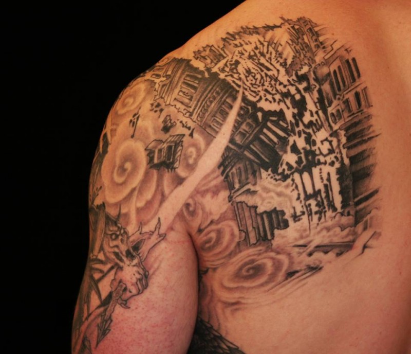 Stunning black and white back and shoulder tattoo of corrupted city