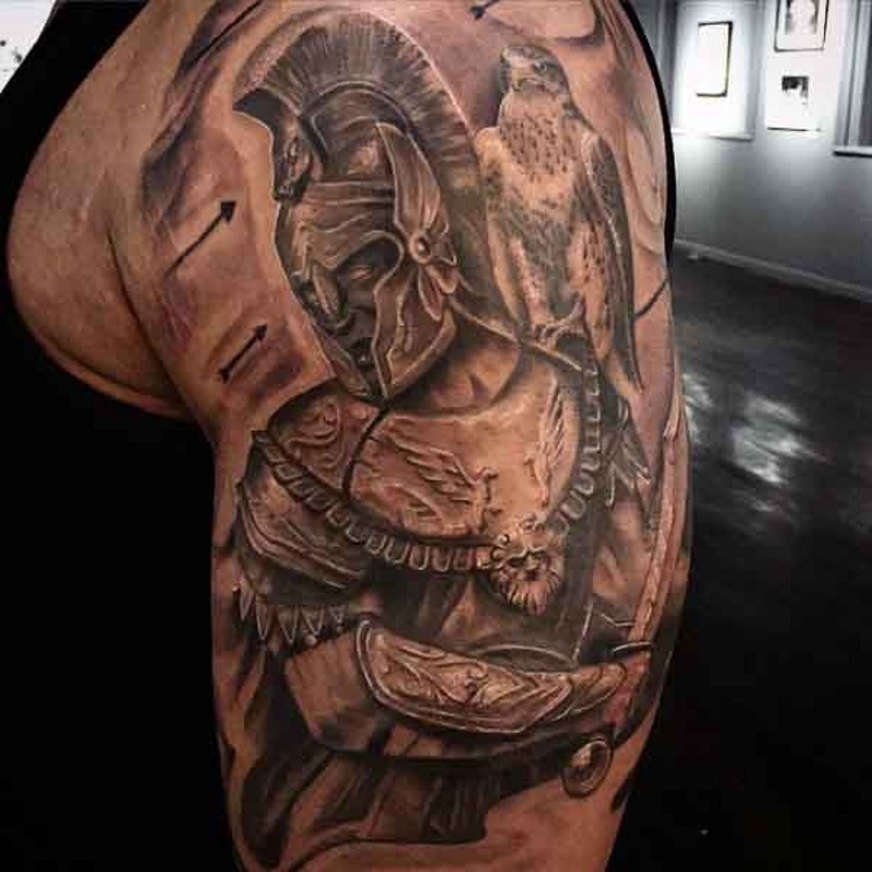 Stunning black and white detailed looking ancient warrior tattoo on shoulder with eagle