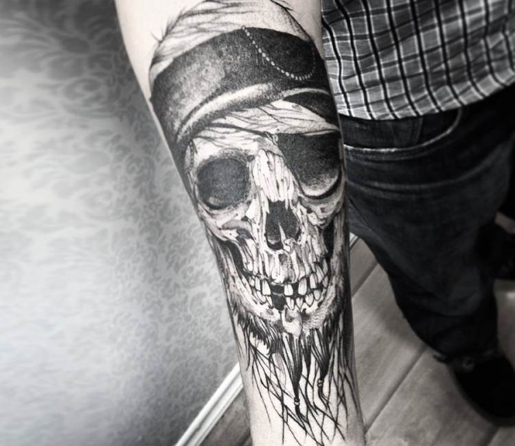 Stunning black and white forearm tattoo of pirate skull