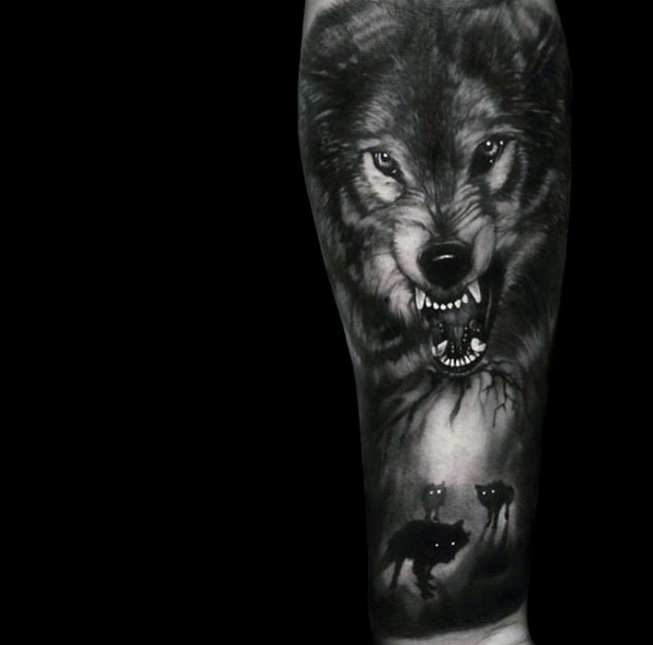 Stunning black and white very detailed half sleeve tattoo of mystical wolves