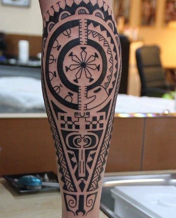 Stunning black ink very detailed tribal ornaments tattoo on leg