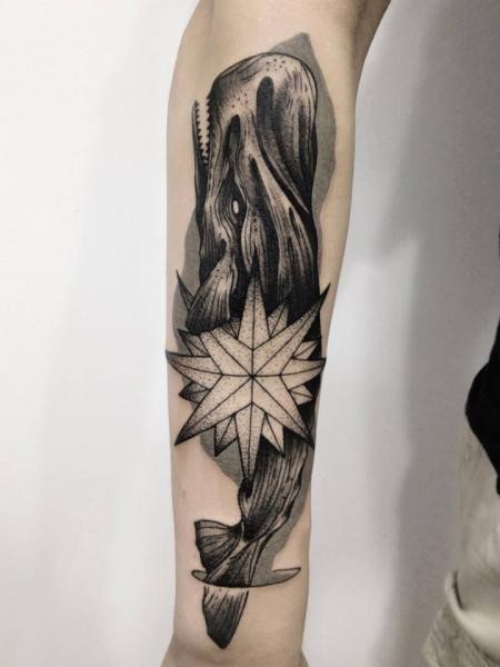Stunning blackwork style painted by Michele Zingales sleeve tattoo of demonic whale with star