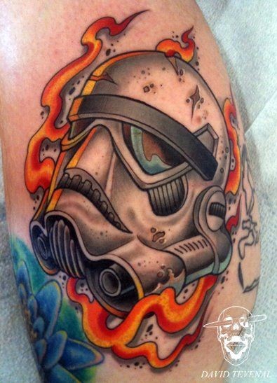 Stunning cartoon like colored storm troopers helmet tattoo combined with flames