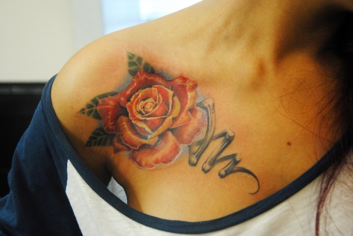 Stunning colored big mechanical rose tattoo on shoulder