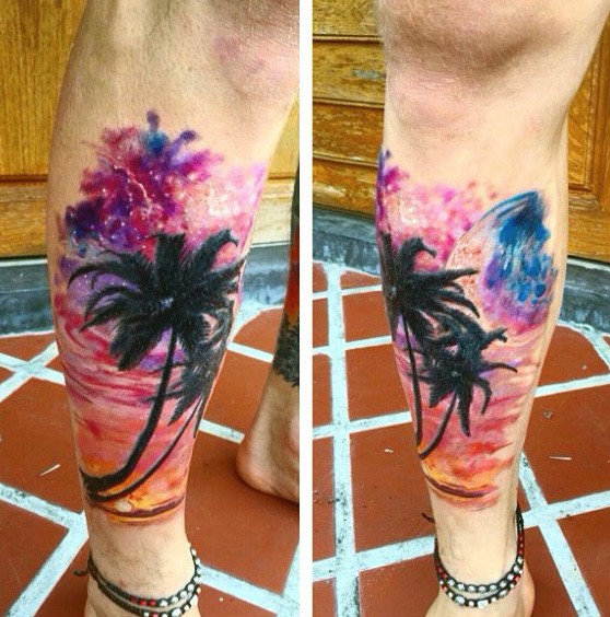 Stunning colored big palm trees with night sky tattoo on leg