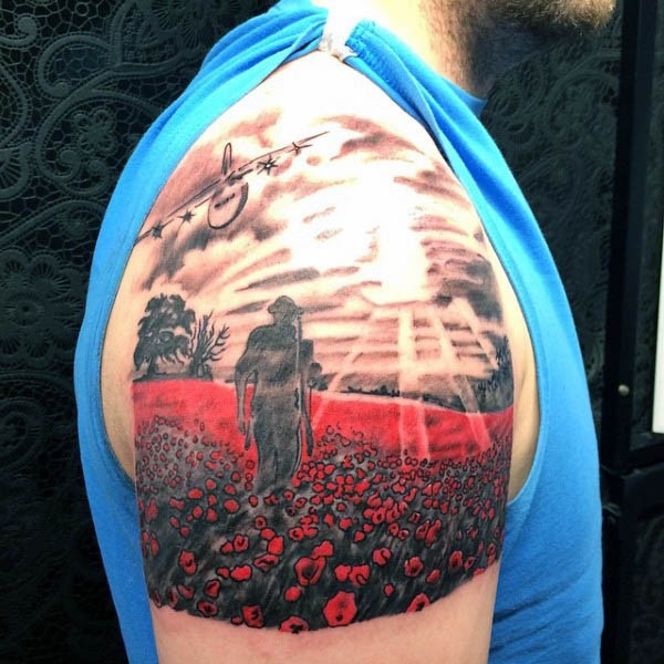 Stunning colorful field with red flowers shoulder tattoo with military motifs